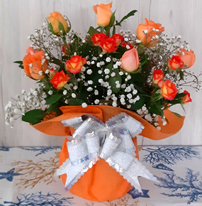 12 Orange Roses Wrapped with a bow tie